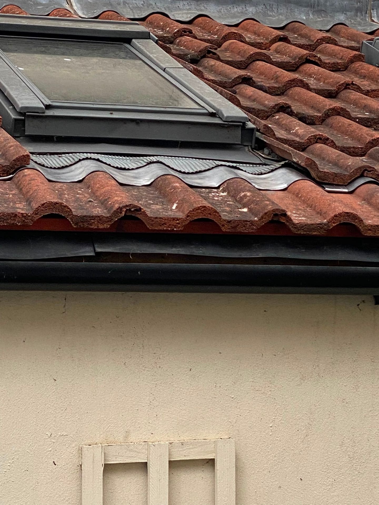 Completed Velux skylight with neat lead soakers and pantile finish
