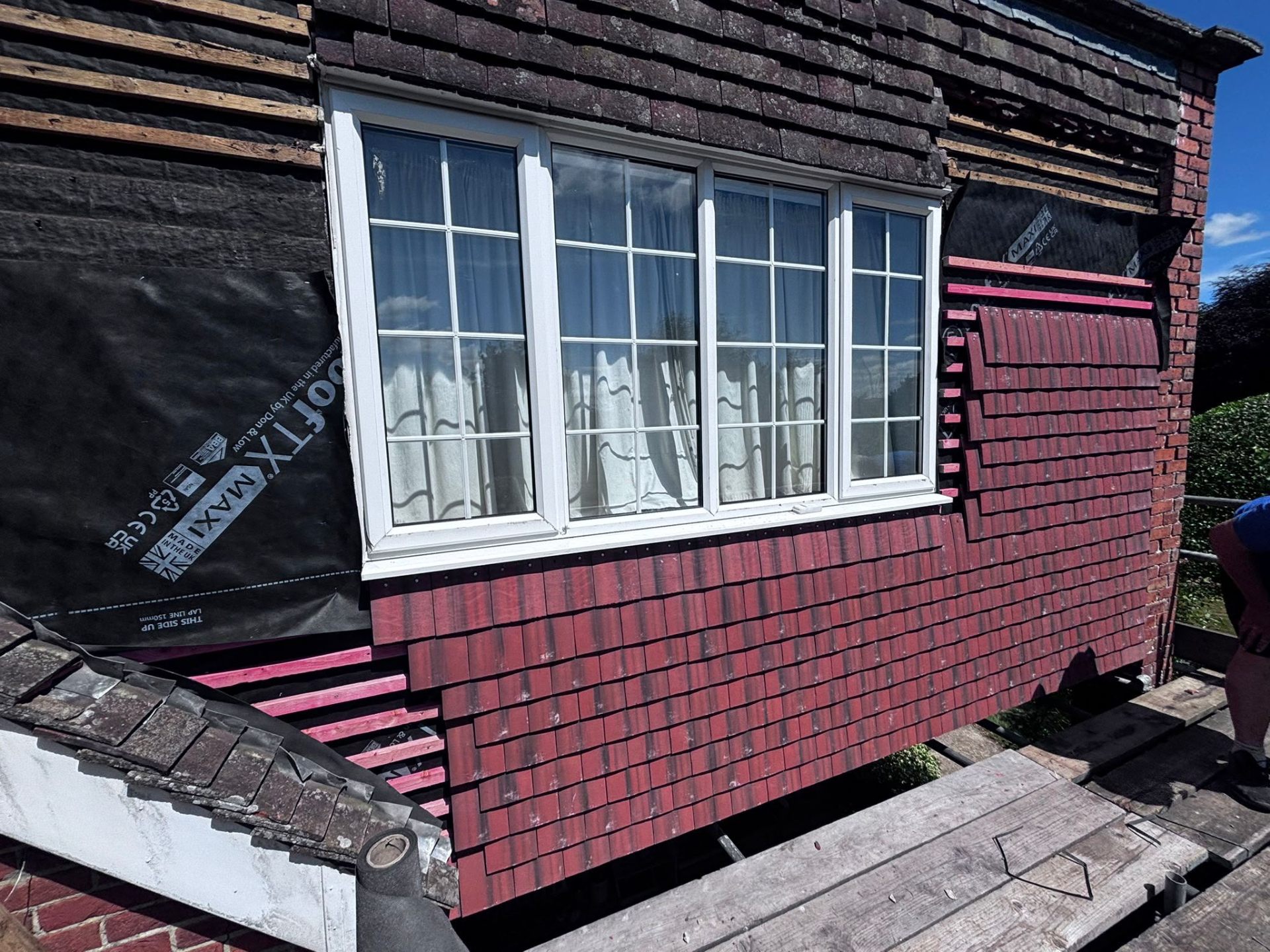 Vertical tiling on the side elevation of a house