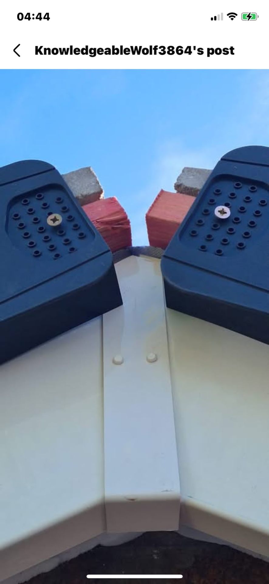 Black dry verge caps with fresh white fascia on a gable end